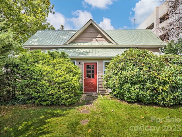 bungalow-style house with a front yard