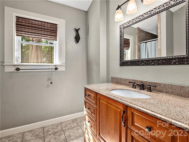 bathroom with tile floors and vanity