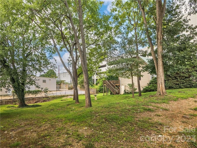 view of yard featuring a wooden deck