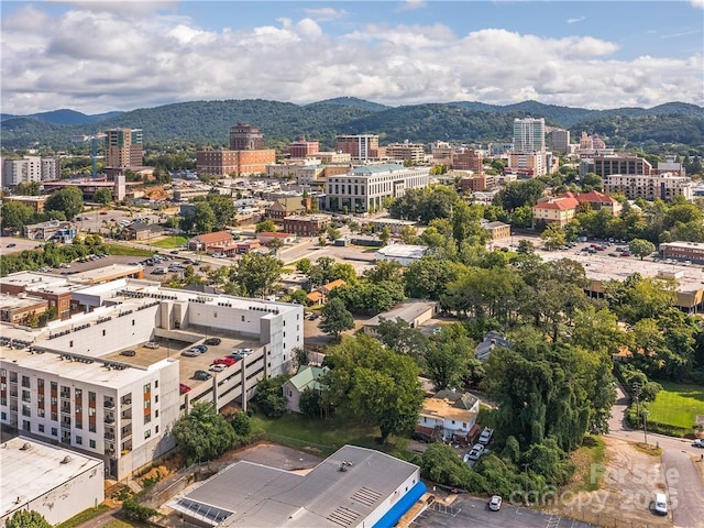 birds eye view of property featuring a mountain view and a view of city