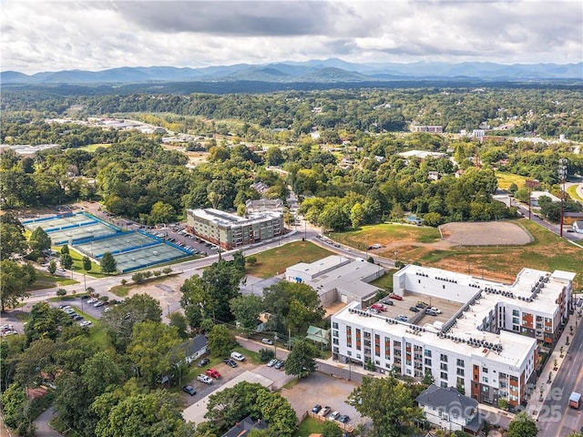 birds eye view of property with a mountain view