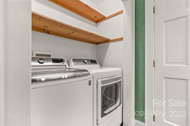 laundry room featuring separate washer and dryer