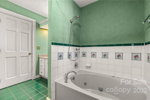 bathroom with vanity, tile flooring, and a textured ceiling