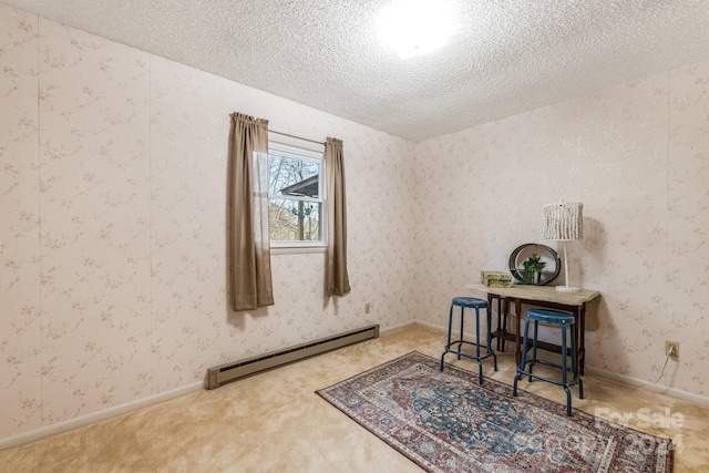 carpeted office space featuring a baseboard heating unit and a textured ceiling