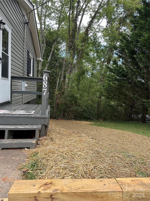 view of yard with a wooden deck