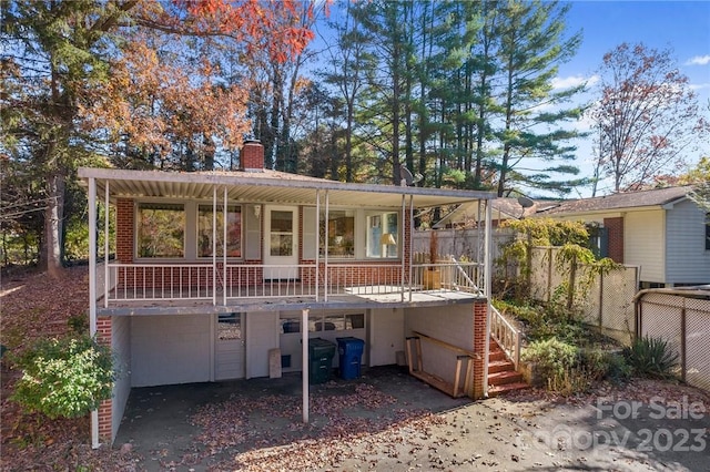 view of front of home with a porch and a garage