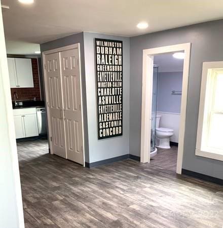 hallway featuring dark hardwood / wood-style flooring