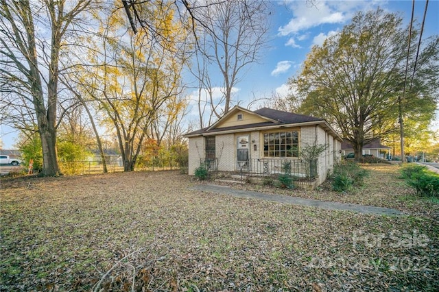 back of house with covered porch