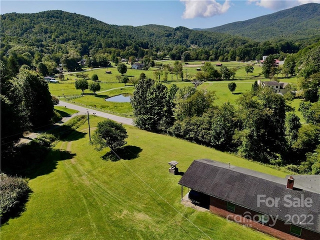 birds eye view of property featuring a mountain view