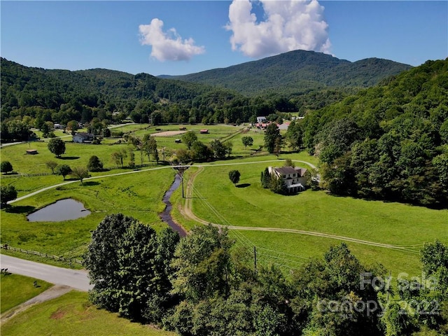 aerial view with a mountain view and a rural view