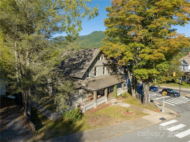 view of front of house with covered porch and a mountain view