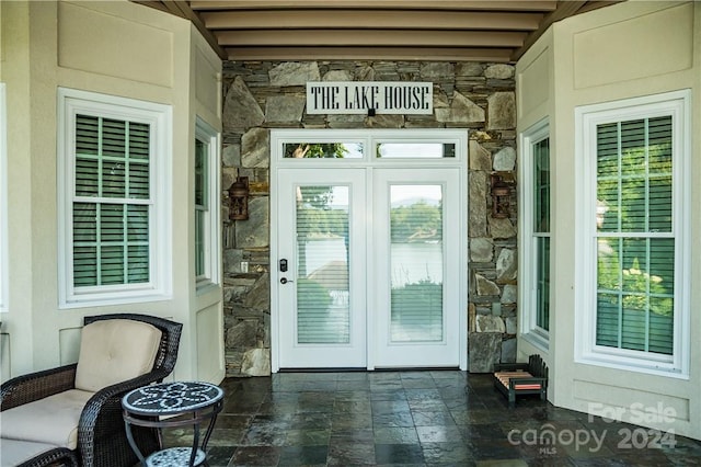 entrance to property featuring french doors