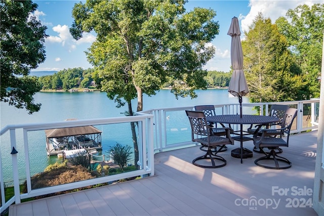 wooden deck with a water view