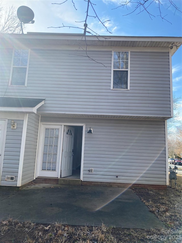 back of property with a patio area