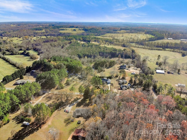 birds eye view of property with a rural view