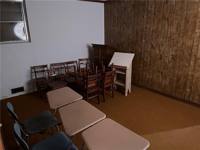 office space featuring wooden walls