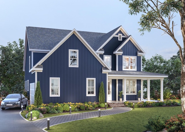 view of front of house featuring a porch and a front yard