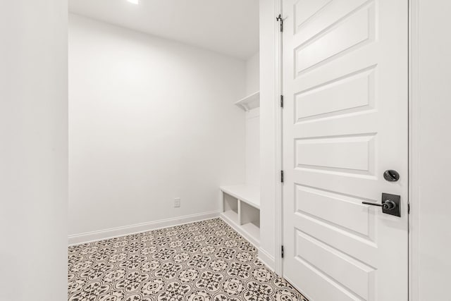 mudroom featuring light tile floors