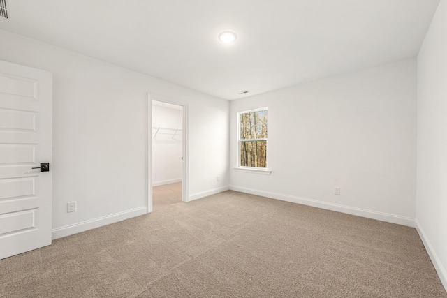 empty room featuring light carpet