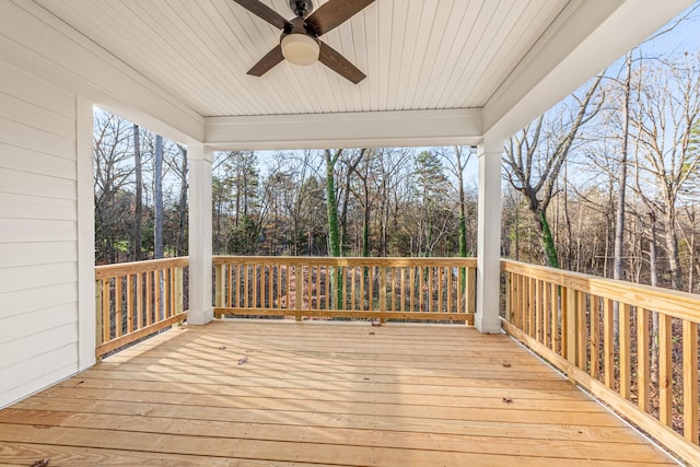 wooden deck featuring ceiling fan