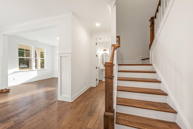 stairs featuring dark hardwood / wood-style floors