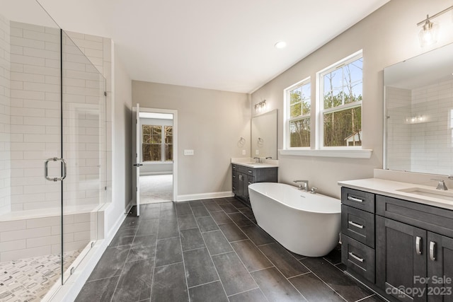 bathroom with shower with separate bathtub, dual sinks, tile floors, and oversized vanity