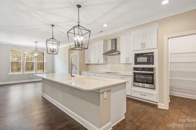 kitchen with sink, dark hardwood / wood-style flooring, backsplash, black appliances, and wall chimney exhaust hood