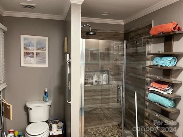 bathroom with crown molding, an enclosed shower, and toilet