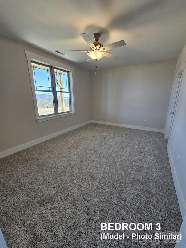 carpeted empty room featuring ceiling fan