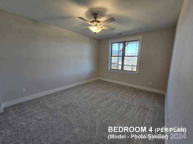 carpeted empty room featuring ceiling fan