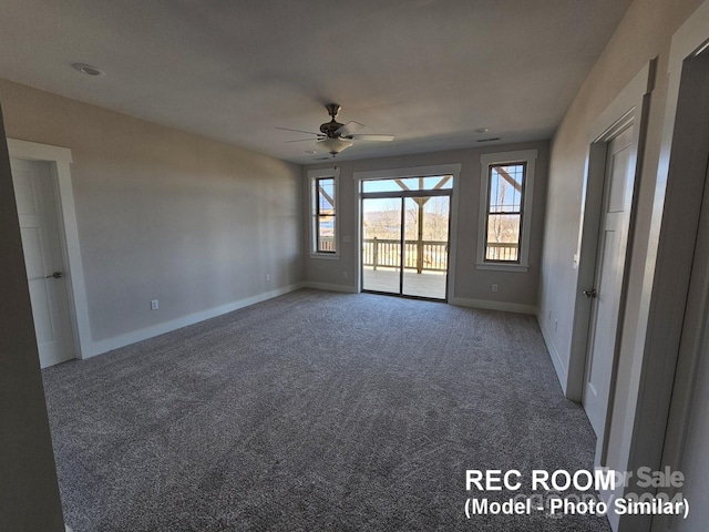 empty room with ceiling fan and carpet flooring