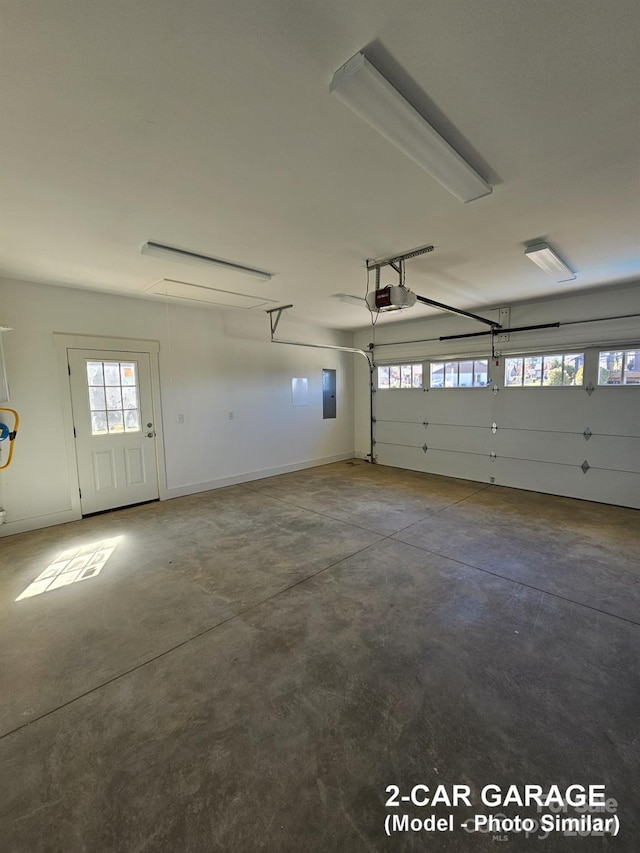 garage with electric panel and a garage door opener