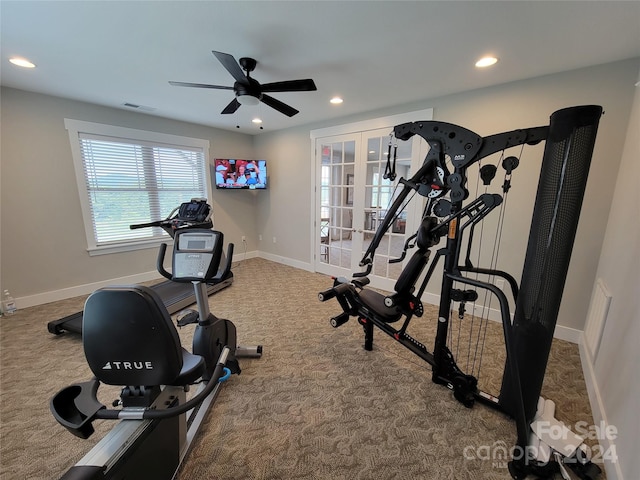 exercise area featuring french doors, carpet flooring, and ceiling fan