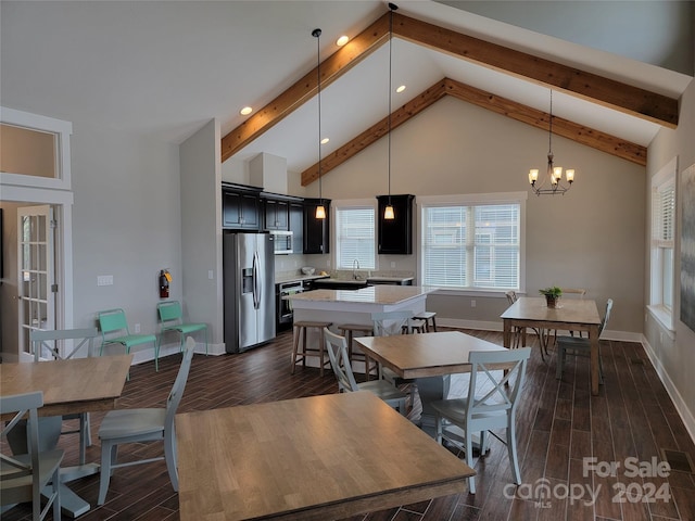 dining area with dark wood-type flooring, high vaulted ceiling, sink, and beamed ceiling