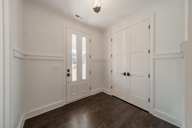 foyer entrance with dark hardwood / wood-style flooring