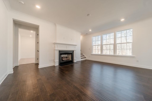 unfurnished living room featuring dark hardwood / wood-style flooring