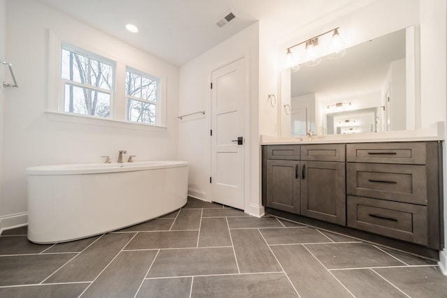 bathroom featuring oversized vanity and tile floors