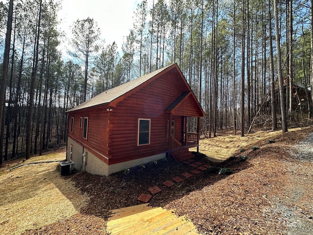 view of property exterior with a deck and central air condition unit