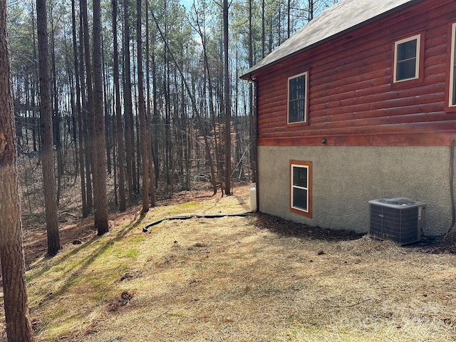 view of yard with central air condition unit