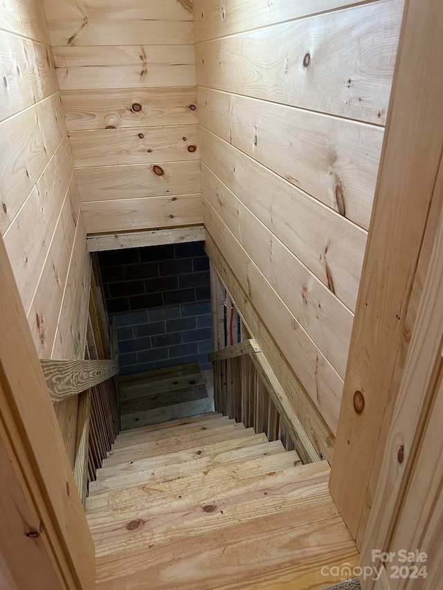 staircase featuring light hardwood / wood-style floors