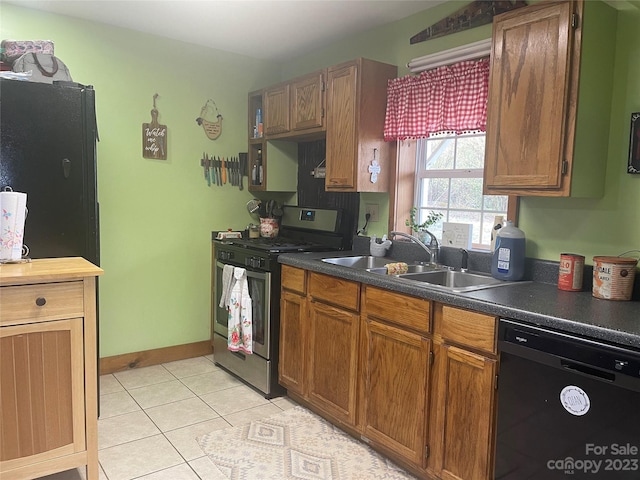 kitchen featuring gas stove, sink, light tile floors, and dishwasher