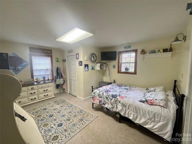 bedroom with light carpet