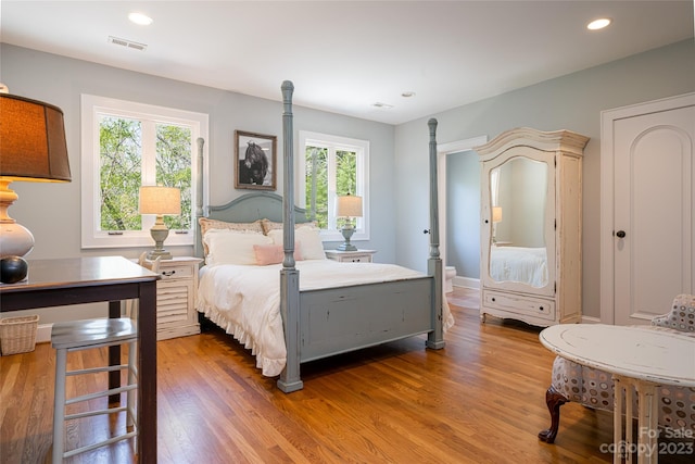 bedroom with hardwood / wood-style floors