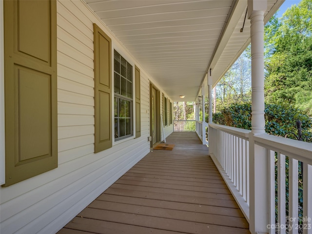 wooden deck featuring covered porch