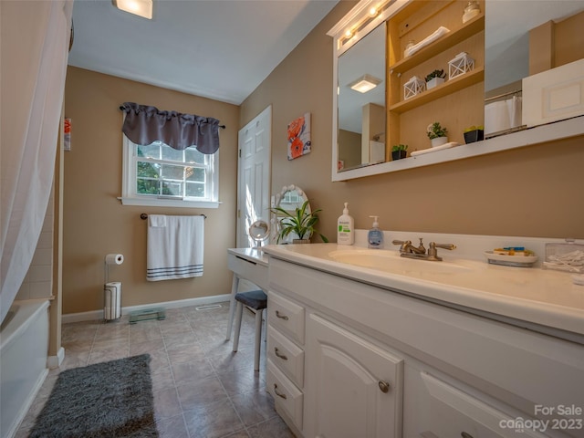 bathroom featuring vanity, shower / bath combo, and tile patterned floors