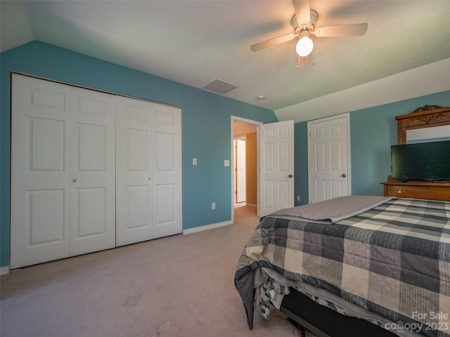 bedroom featuring light colored carpet, vaulted ceiling, and ceiling fan