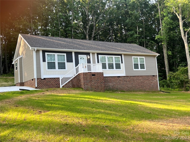 ranch-style home with a front lawn