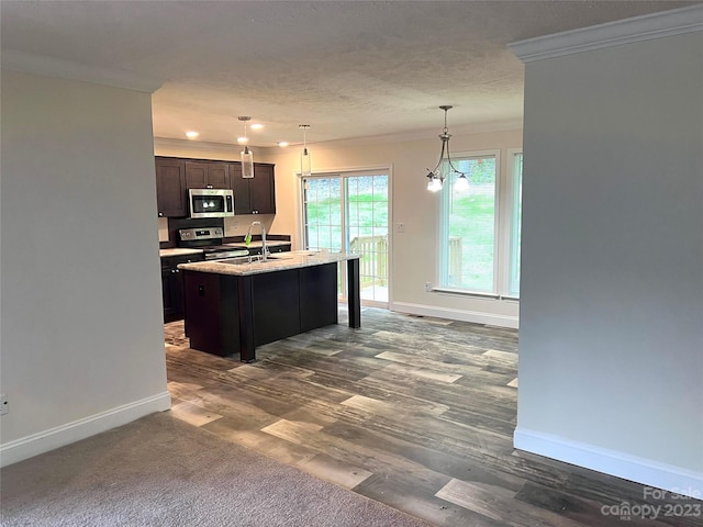 kitchen featuring decorative light fixtures, a notable chandelier, dark hardwood / wood-style floors, and appliances with stainless steel finishes