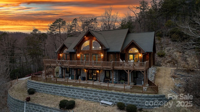 view of back house at dusk