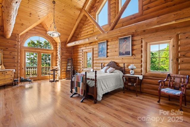 bedroom featuring wood ceiling, log walls, access to outside, and high vaulted ceiling